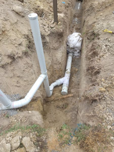 sewer main extension with connection of existing house drains 